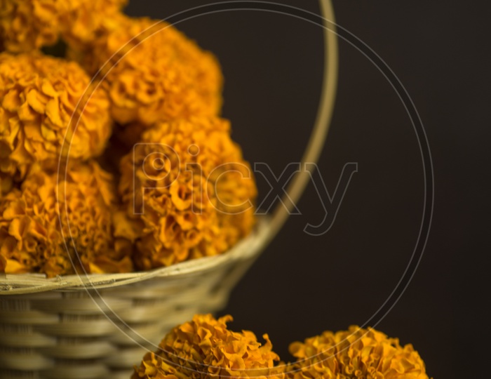 Marigold Flowers In a Pooja Basket on an Black Background