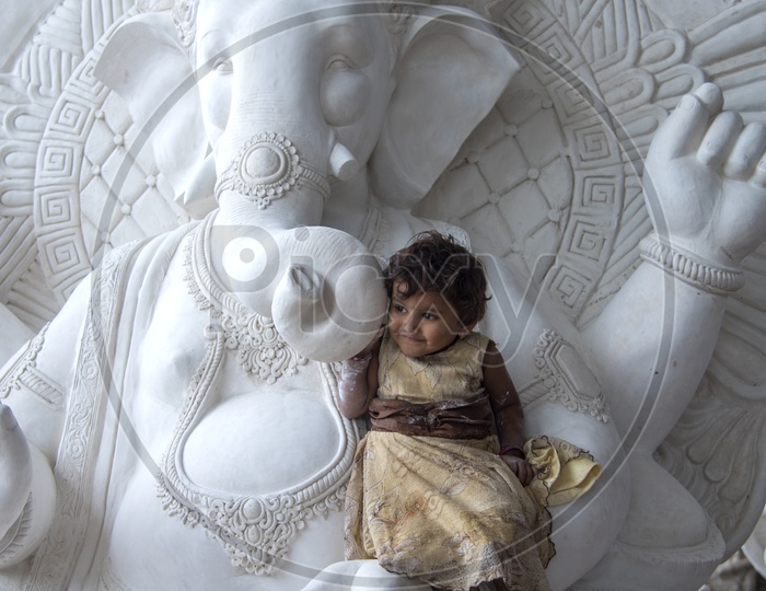 A Small Child At Ganesh Idol Making Workshop