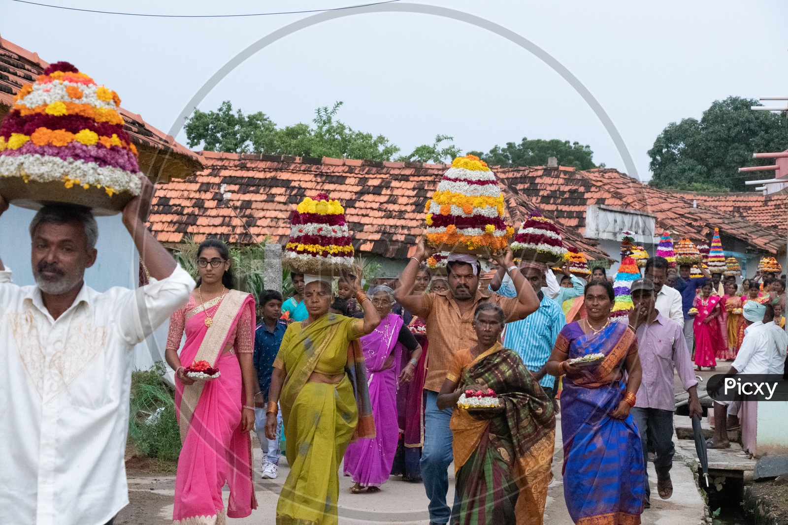 Telangana People Carrying Bathukamma On Head During Bathukamma Celebrations Rural Telangana Villages