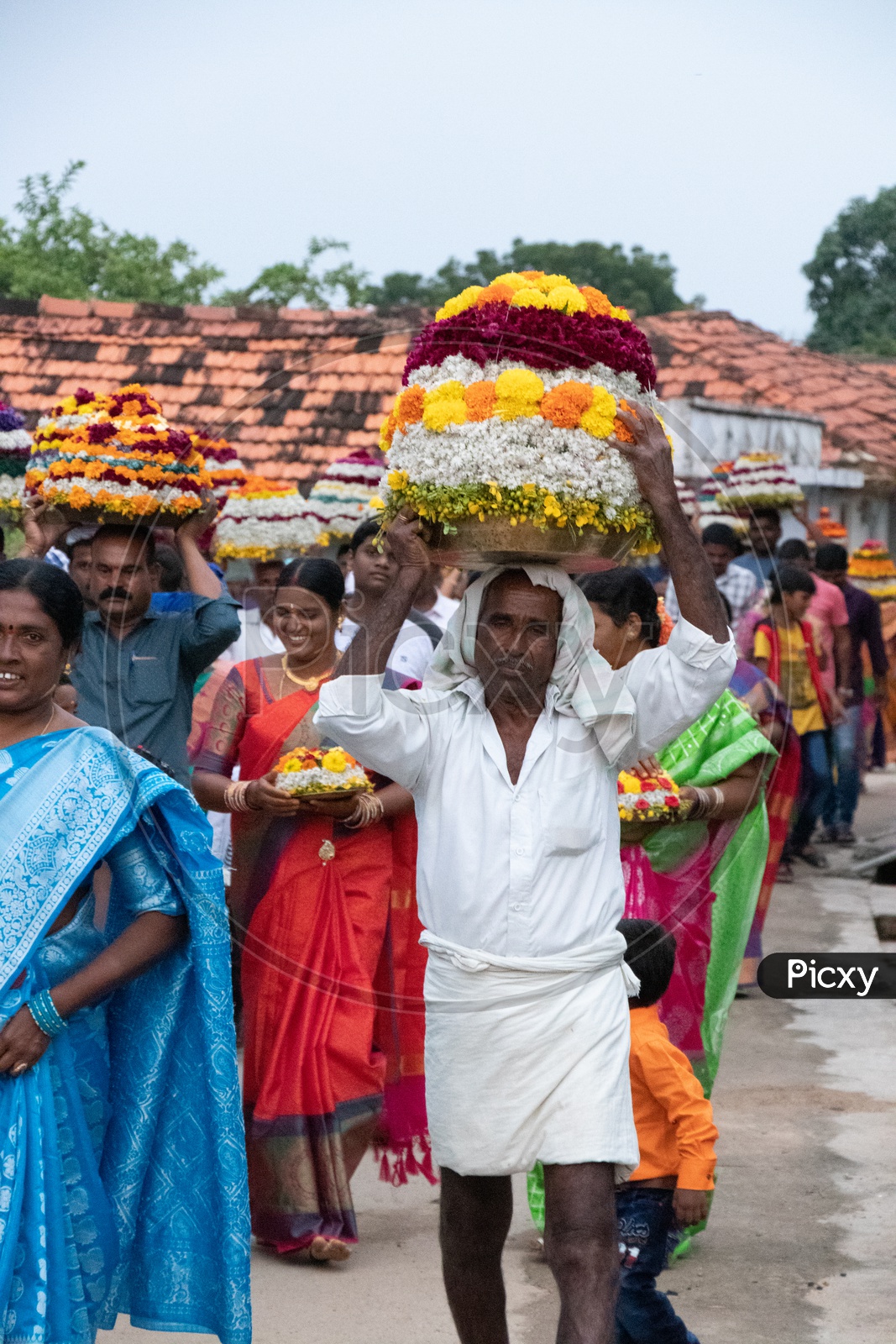 Telangana People Carrying Bathukamma On Head During Bathukamma Celebrations Rural Telangana Villages