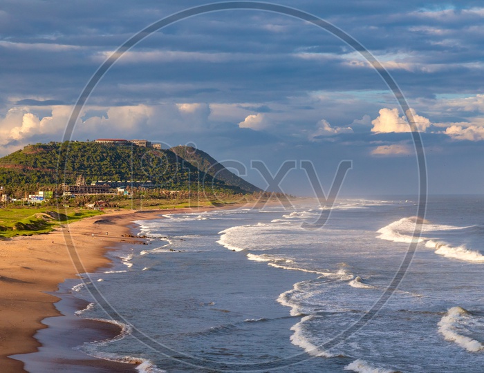 Visakhapatnam Beach View on a Sunny day with Blue Clouds in the sky