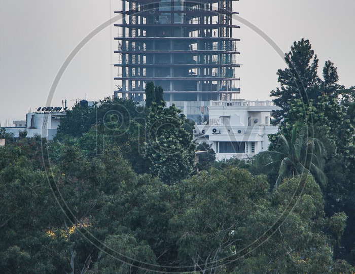 New buildings coming up as greenery disappears.