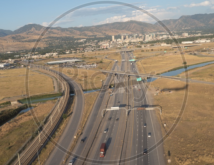 Aerial view of highway roadlines against Wasatch Mountains