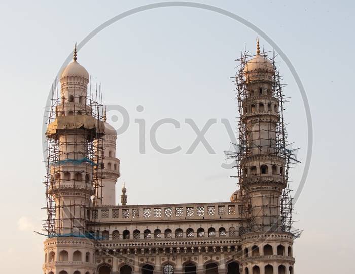 Charminar With Vendor Stalls  And Visitors Composition