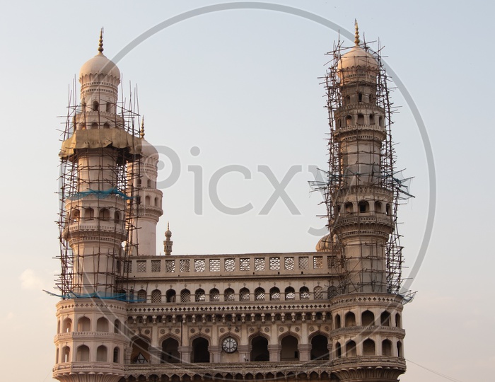 Charminar With Vendor Stalls  And Visitors Composition