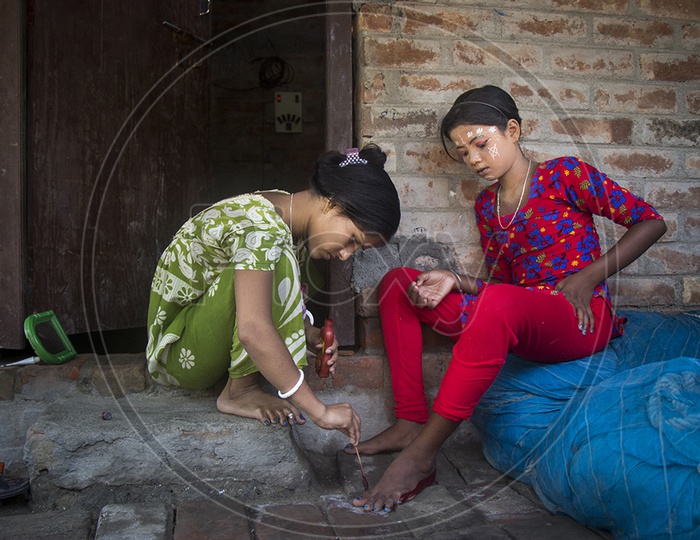 Indian Girls Putting On Red Ink To Feet