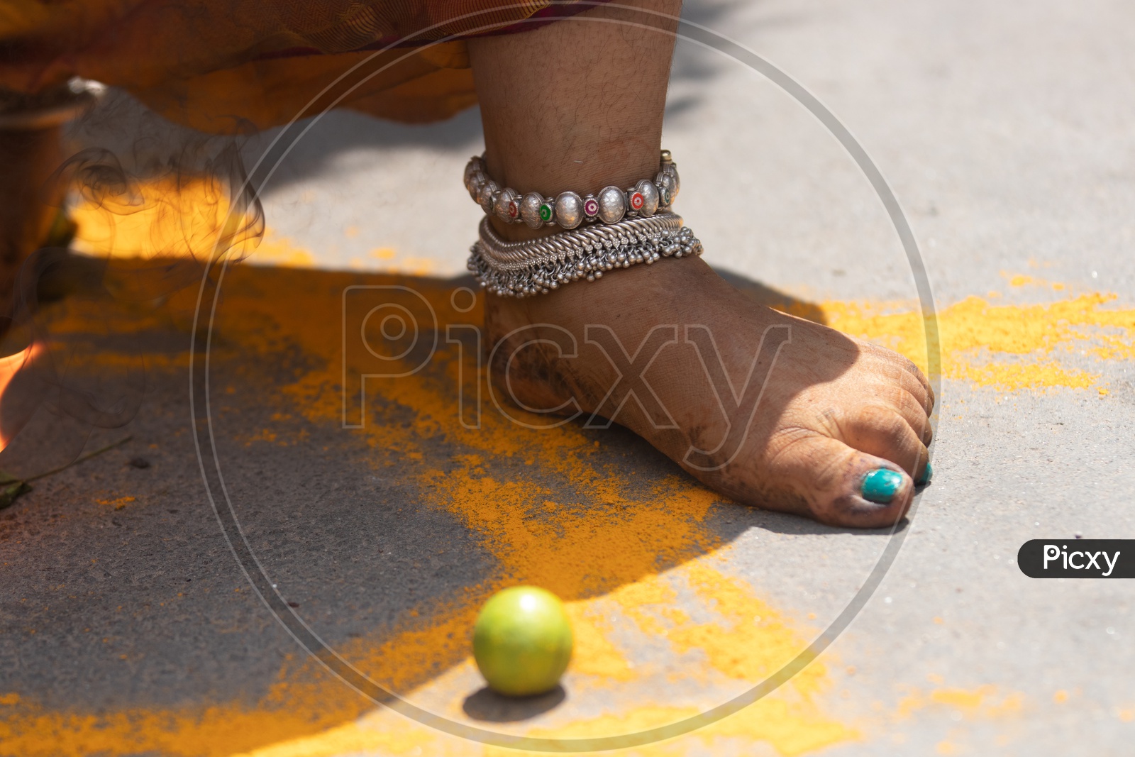 Jogini Or Goddess Woman Stepping And Crushing Lemons Over Turmeric Rangoli During Bonalu Festival