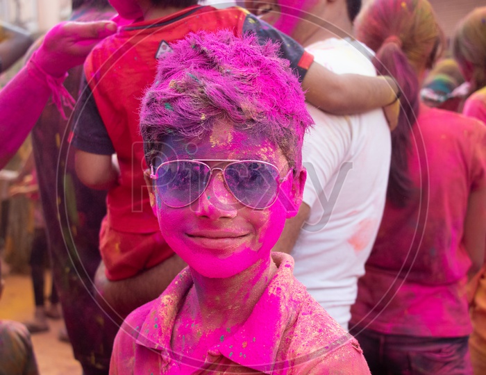 Indian Children Celebrating Holi Festival Filled In Colors