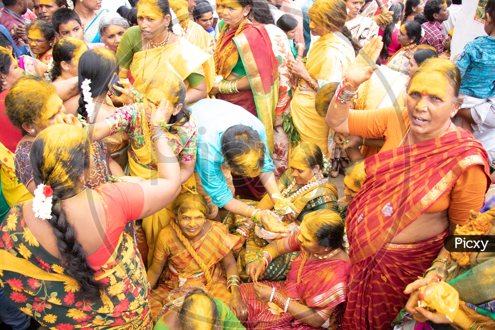 Hindu Devotees Filled In Turmeric Powder During Bonalu Festival At Bulkampet Yellamma Kalyanam