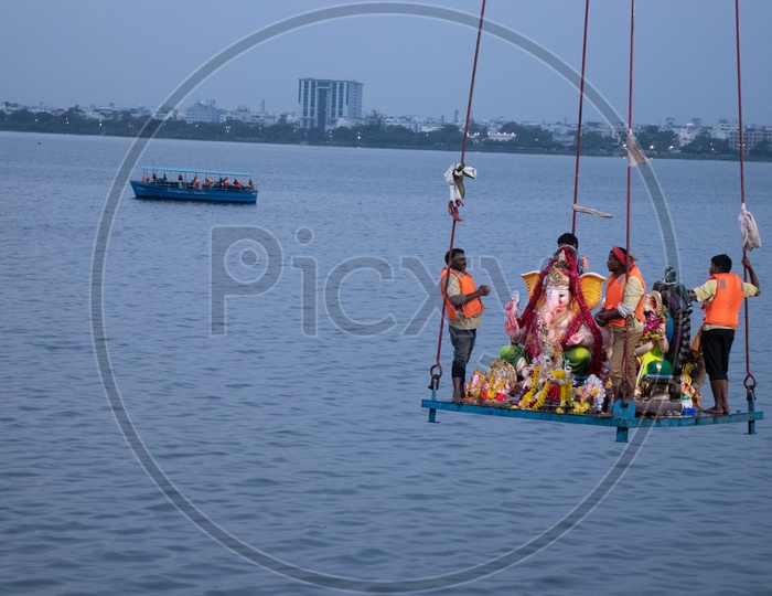 Lord Ganesh Idols On Cranes While Visarjan or Nimarjan event At Tankbund In Hyderabad