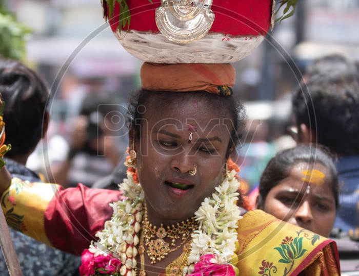 Hindu Devotees Carrying Bonam On Head During Bonalu  Festival Celebrations At Ujjaini Mahakali Temple