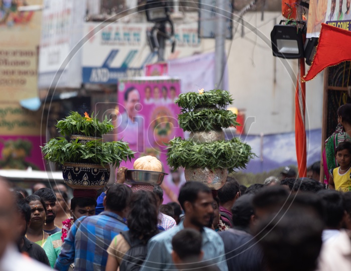 Hindu Devotees Carrying Bonam On Head During Bonalu  Festival Celebrations At Ujjaini Mahakali Temple