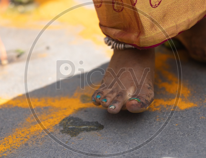 Jogini Or Goddess Woman Stepping And Crushing Lemons Over Turmeric Rangoli During Bonalu Festival