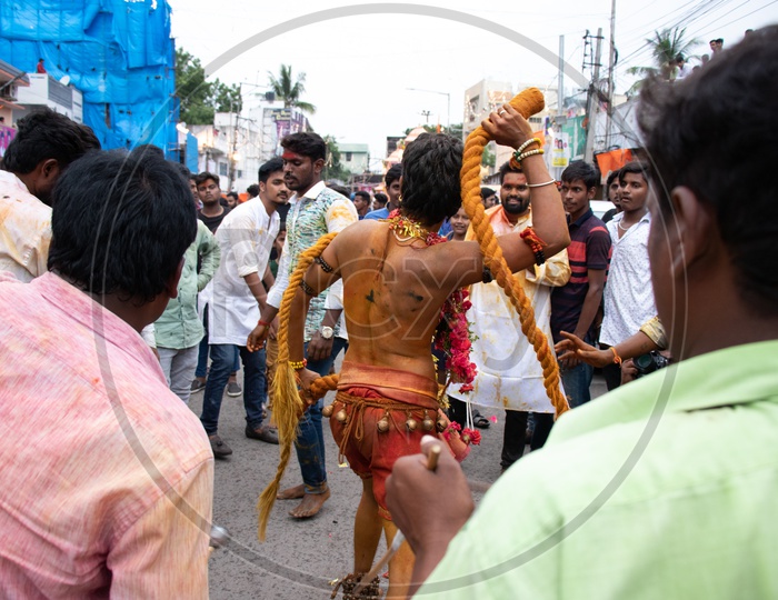 Pothuraju Surrounded By Crowd During Bonalu Festival Celebrations