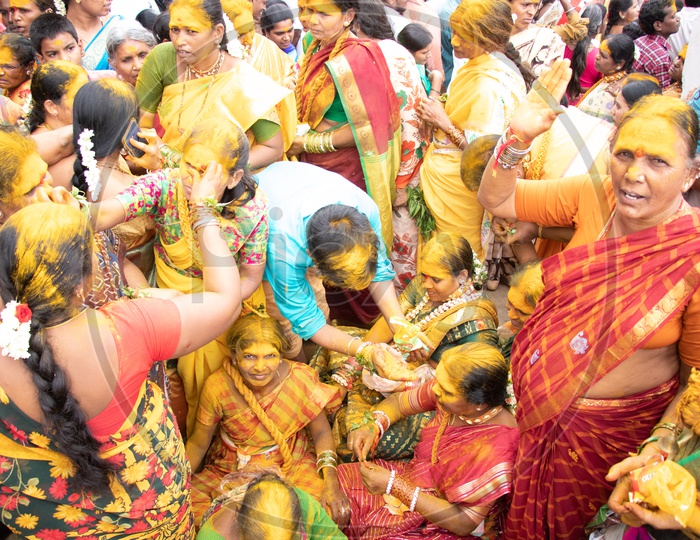 Hindu Devotees Filled In Turmeric Powder During Bonalu Festival At Bulkampet Yellamma Kalyanam