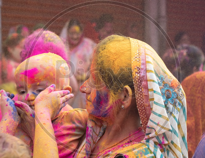 Indian Mother Celebrating Holi  With her Child