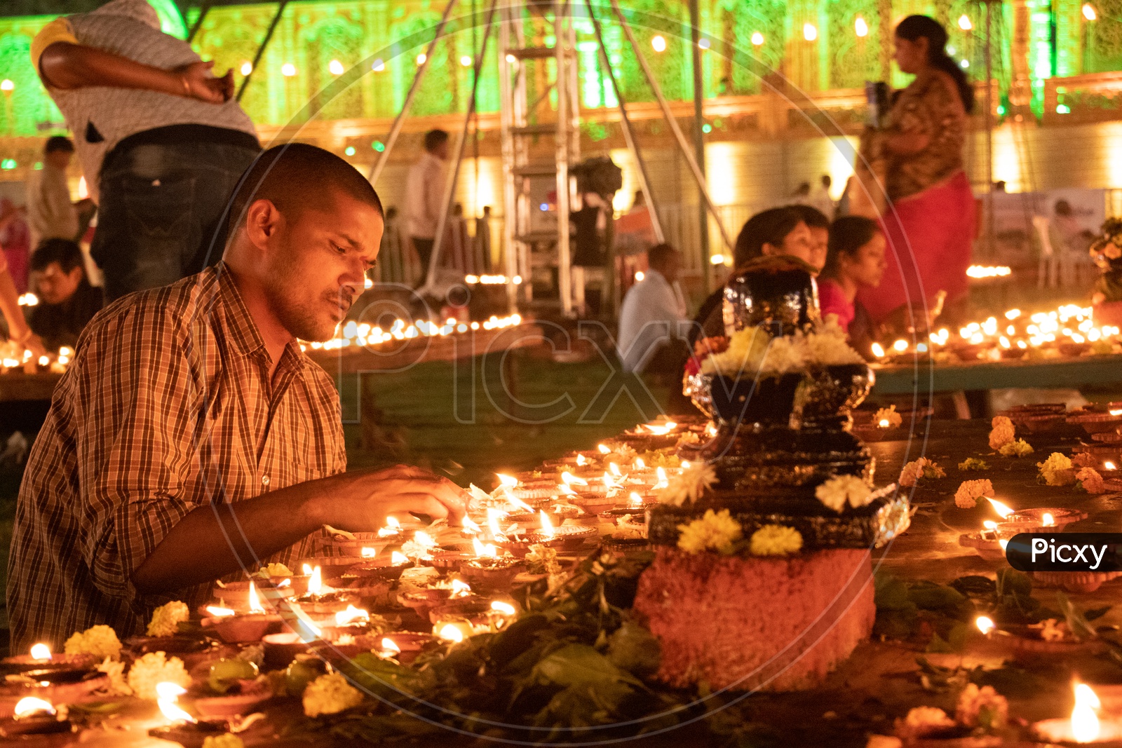 Hindu Devotees Offering Prayers by Lighting Dias At Koti Deeposthavam Event in Hyderabad