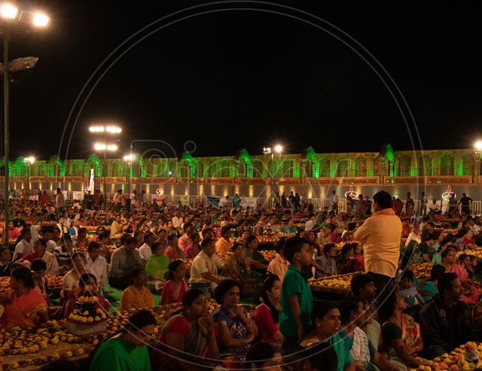 Devotees Offering Prayers At Koti Deeposthavam Event in Hyderabad