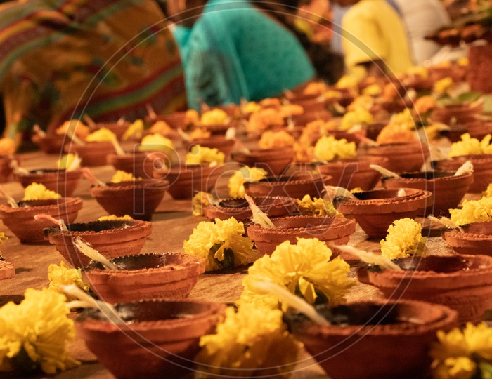 Indian Hindu Devotees Offering Prayers By Lighting Dias At Koti Deeposthavam Event  in Hyderabad