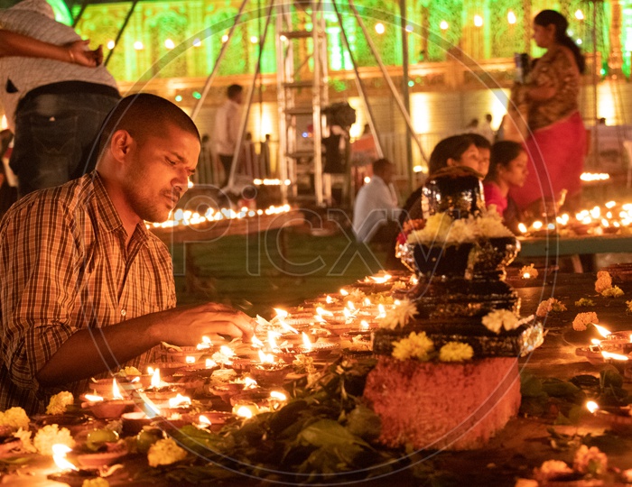 Hindu Devotees Offering Prayers by Lighting Dias At Koti Deeposthavam Event in Hyderabad