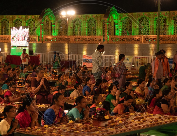 Devotees Offering Prayers At Koti Deeposthavam Event in Hyderabad