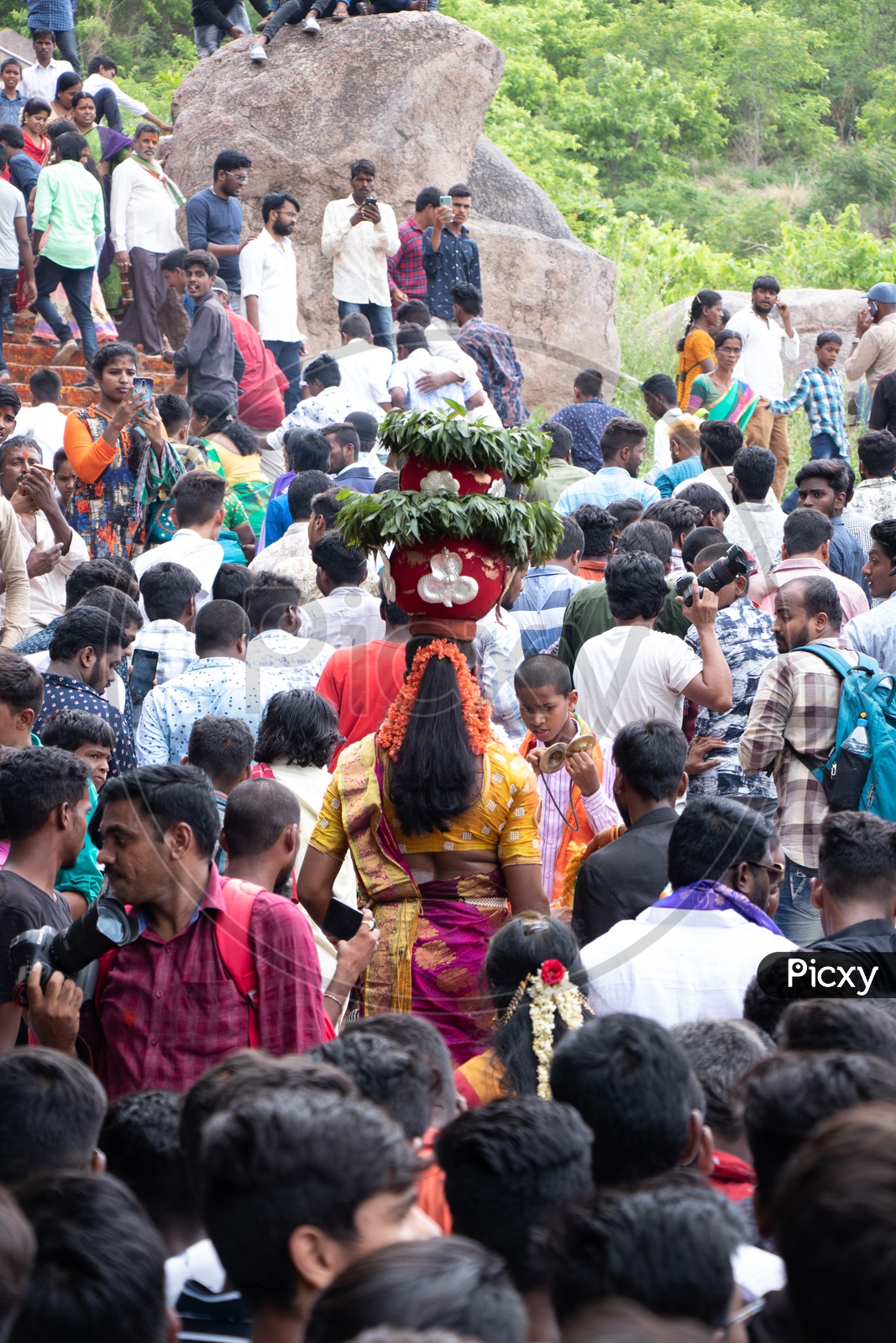 Woman Carrying Bonam On Head At Golconda Fort During Telangana Bonalu  Festival Celebrations