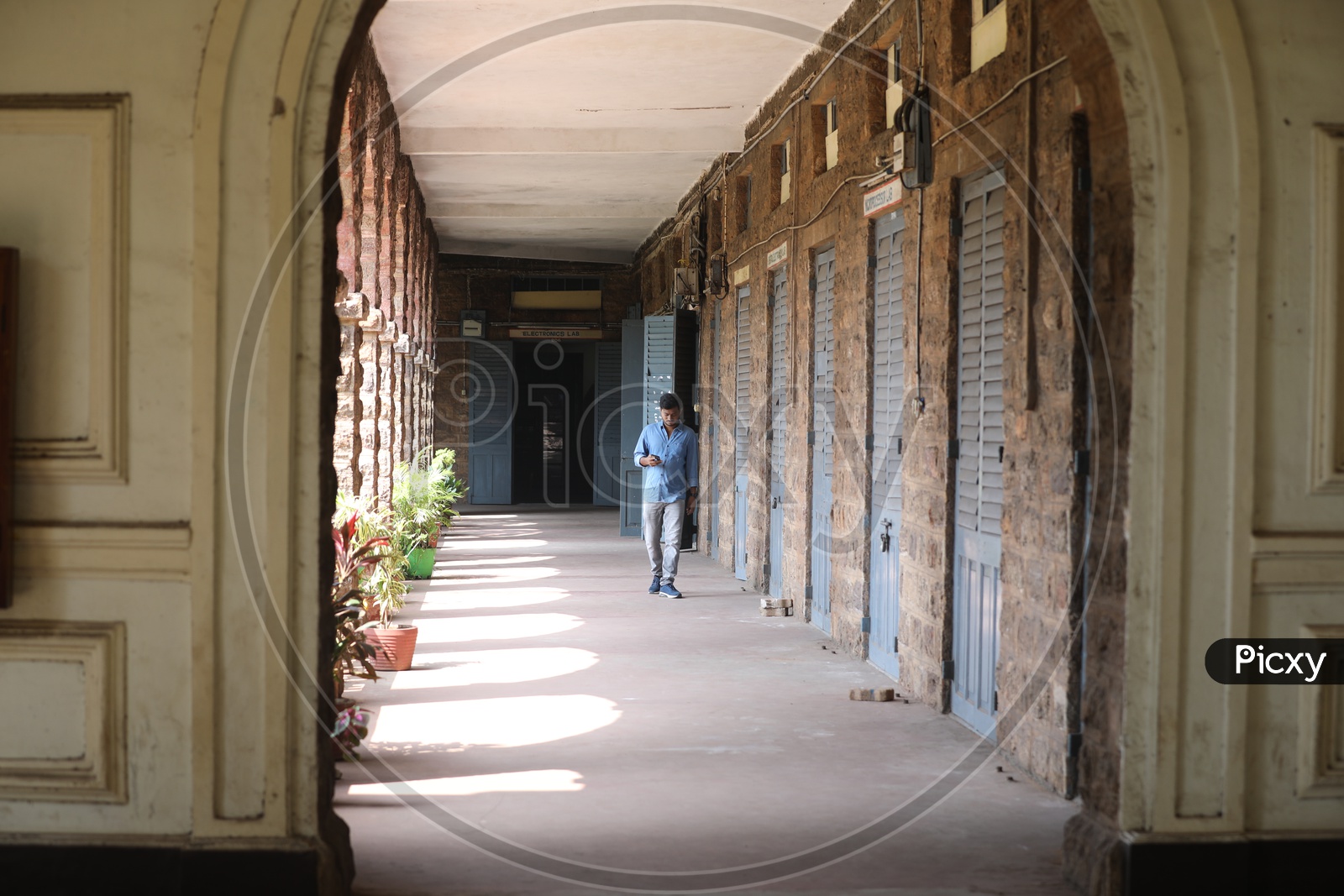 Indian College boy walking in the hallway