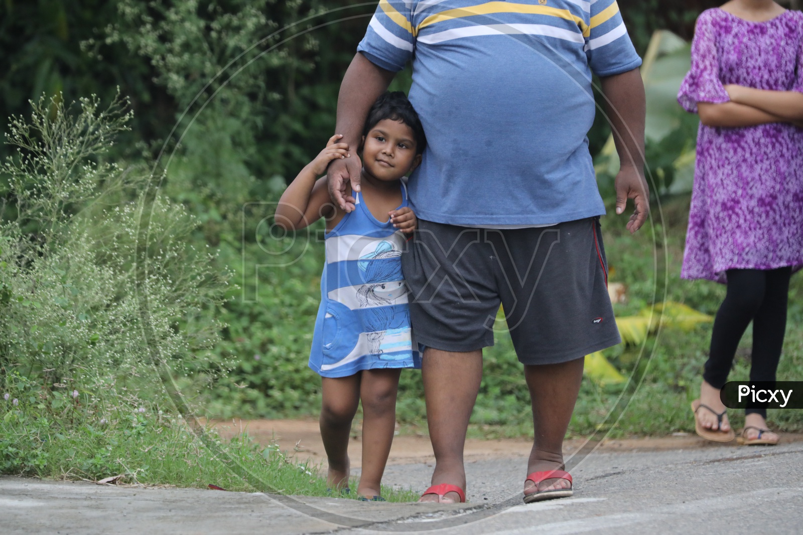 Indian Fat Man with a little girl