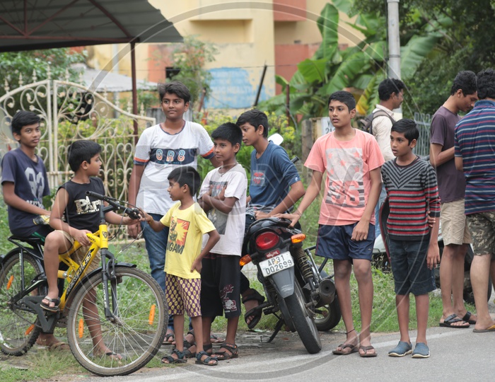 Group of Indian Kids waiting by the road