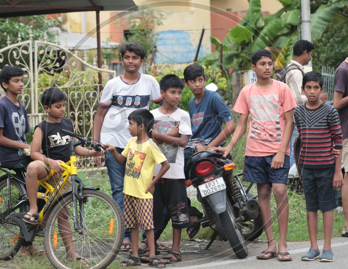 Group of Indian Kids waiting with their bicycles