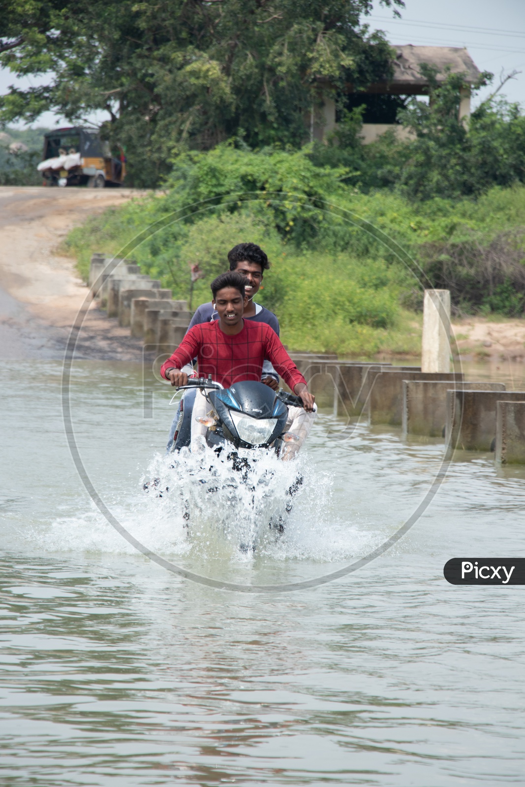 Bikers Crossing A Flooded Bridge in Rural Villages Of  Telangana