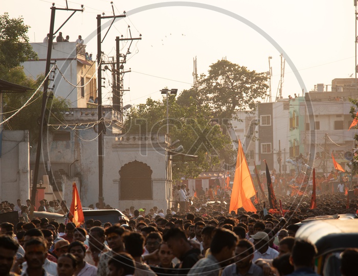 Crowd Of Hindu devotees Carrying Saffron Flags At Sri Rama Navami Shoba Yatra