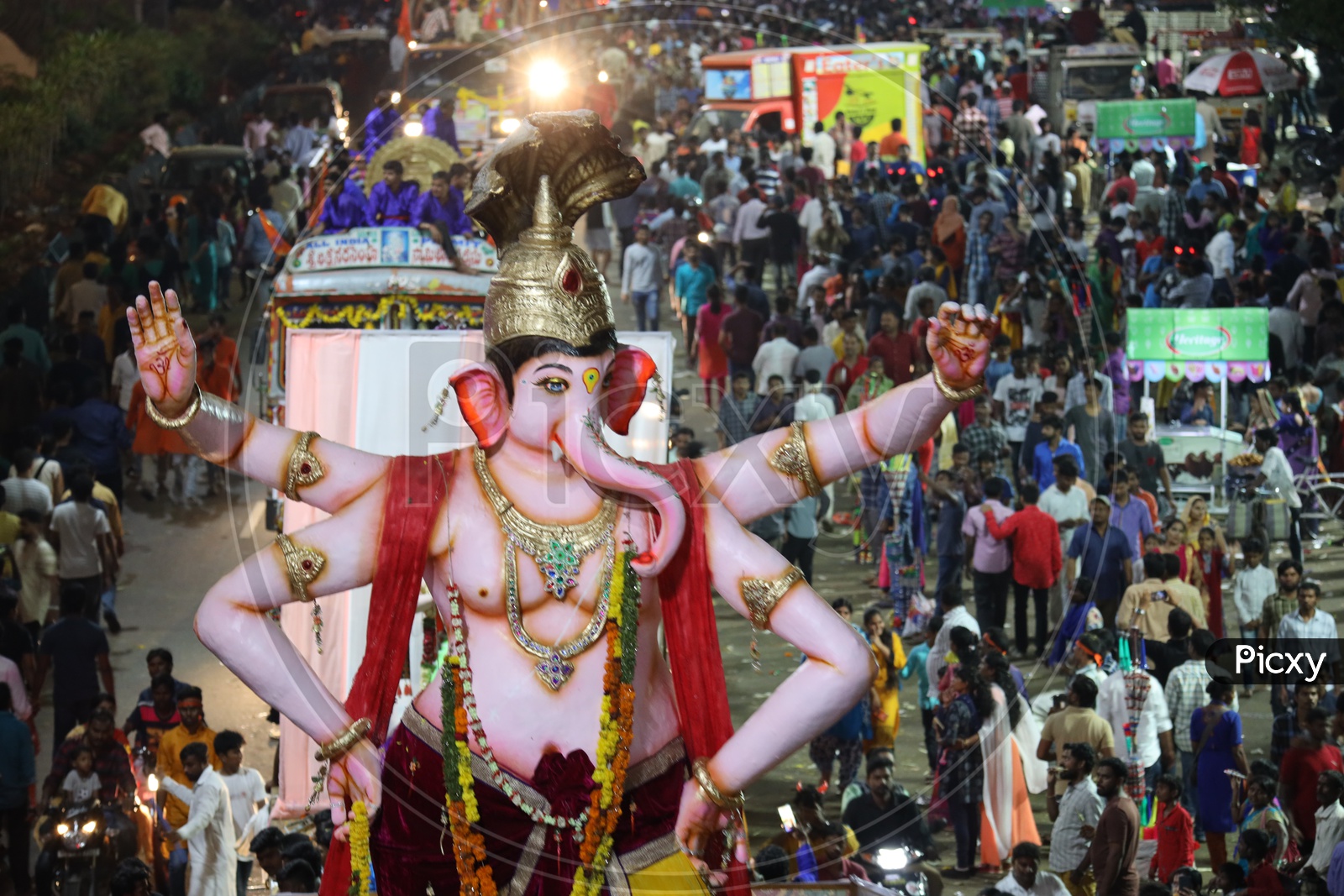 Image of Ganesh Idols In Trucks And Crowd Of Devotees At Tank Bund For ...