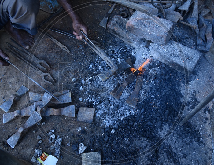 Indian Blacksmith Forges the Hot Metal