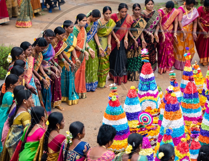 Women Of Telangana Celebrate Bathukamma A Floral Decoration Made From Medicinal Flowers And Fragrances Arranged Like A Temple Gopuram