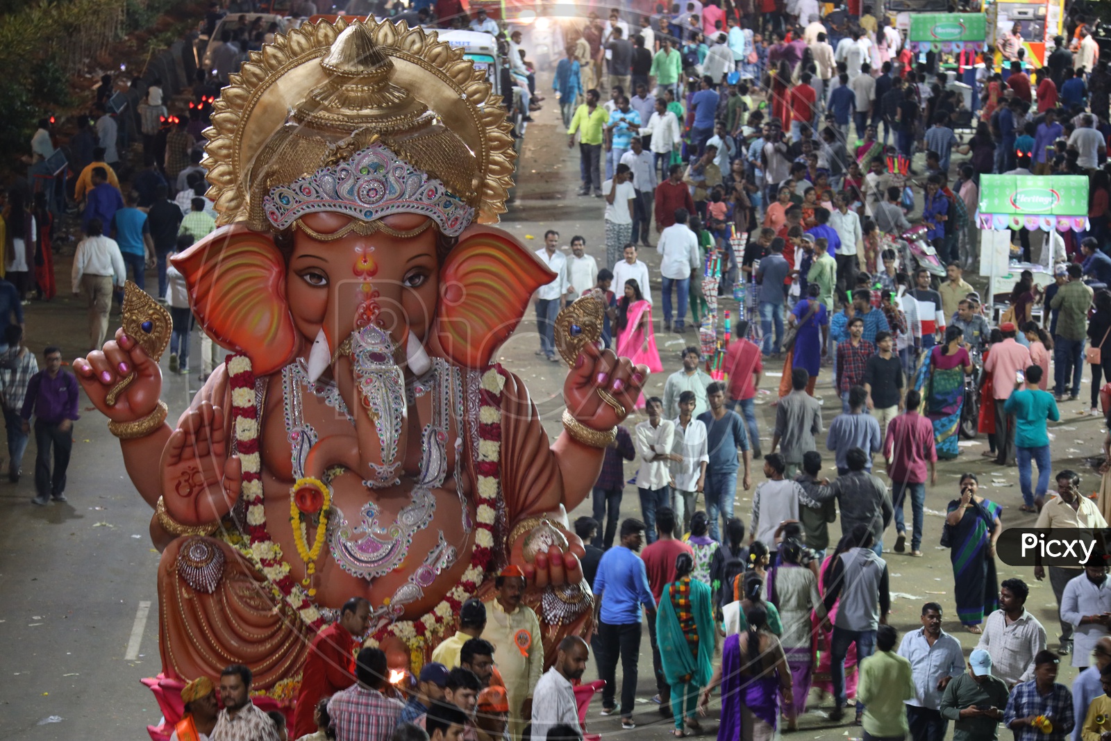 Image of Ganesh Idols In Trucks And Crowd Of Devotees At Tank Bund For ...