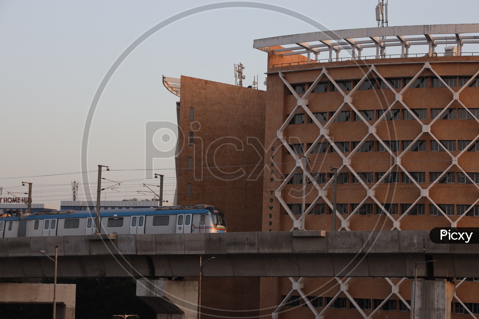 Hyderabad Metro Train  Running on track Composition With Cyber Towers In Background