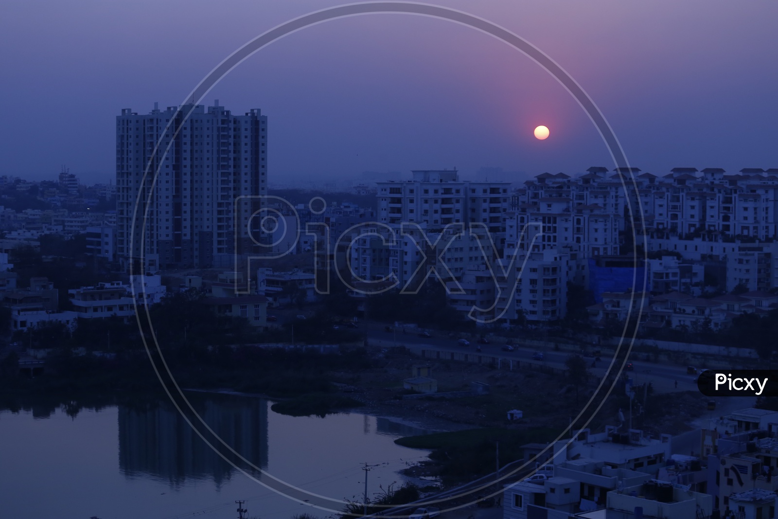 Sunset Over Hyderabad City Scape With Lake And High Rise Buildings Composition
