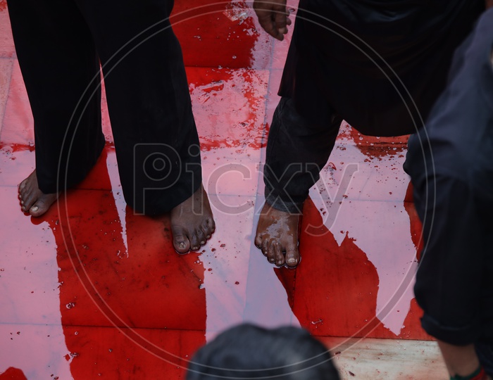 Reflection of  Devotees  On Blood Surface At Muharrum mourning
