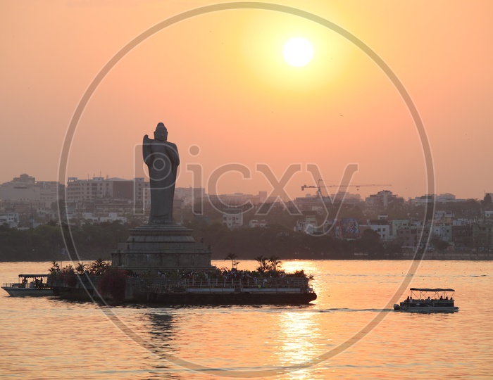 Buddha Statue In Hussain Sagar Lake  With Sunset Sky in Background