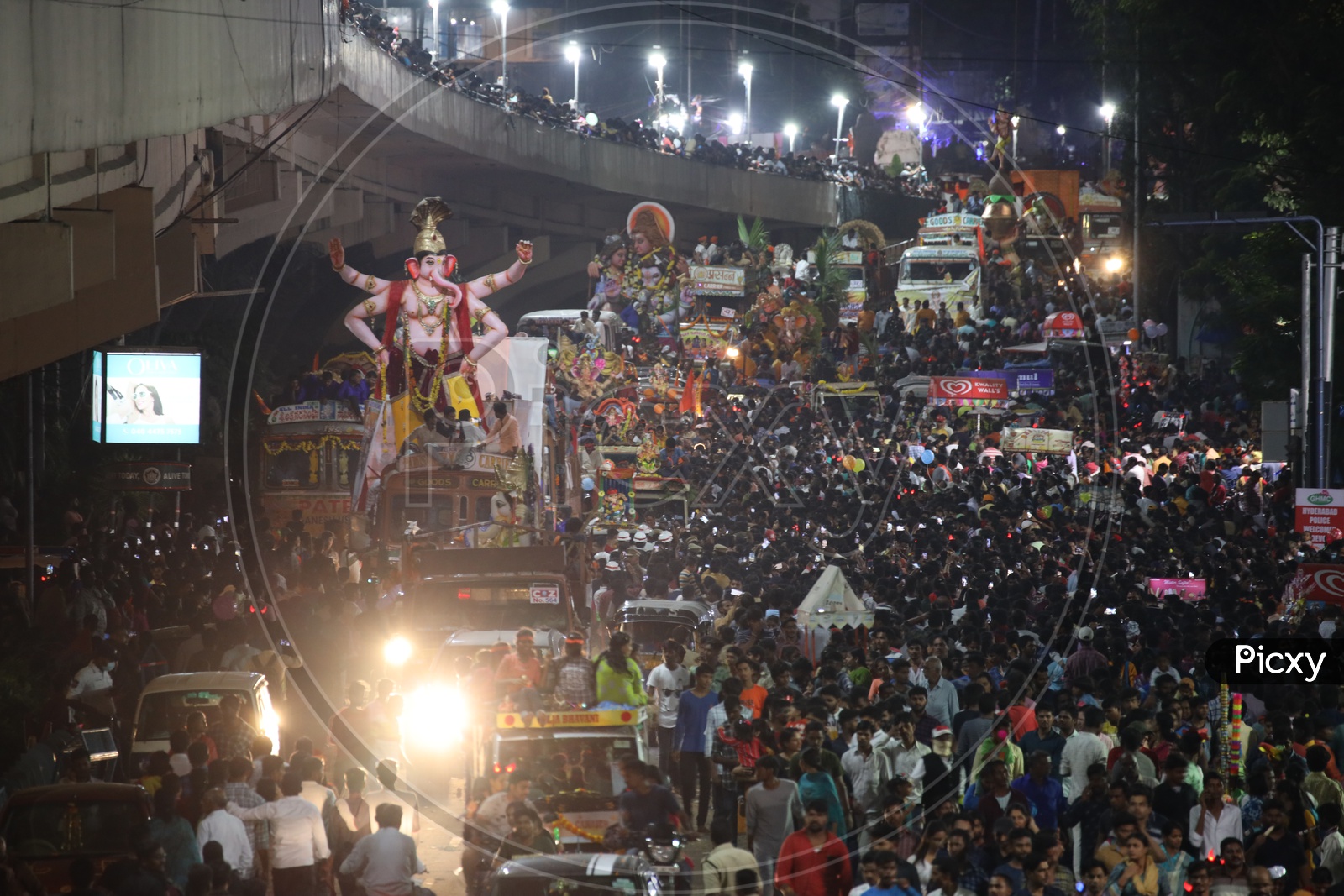 Ganesh Idols In Trucks And Crowd Of Devotees  At Tank Bund For Immersion in Hussain Sagar Lake  During Ganesh Visarjan Or Nimarjan  Event In Hyderabad