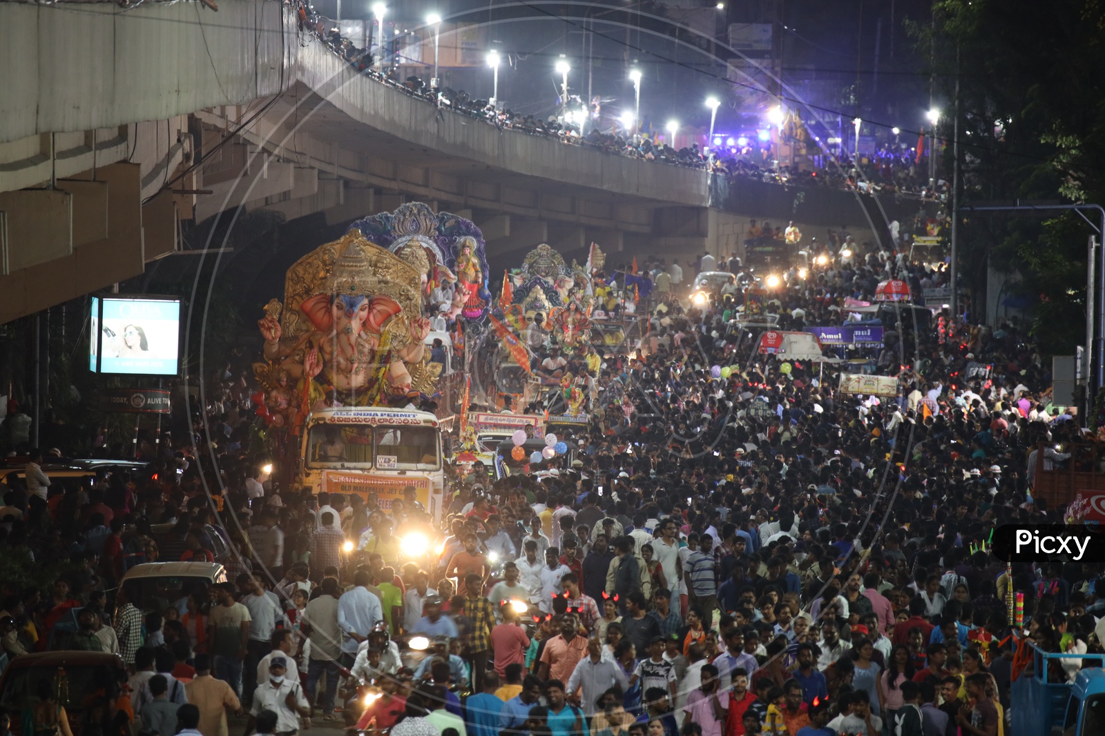 Image Of Ganesh Idols In Trucks And Crowd Of Devotees At Tank Bund For 