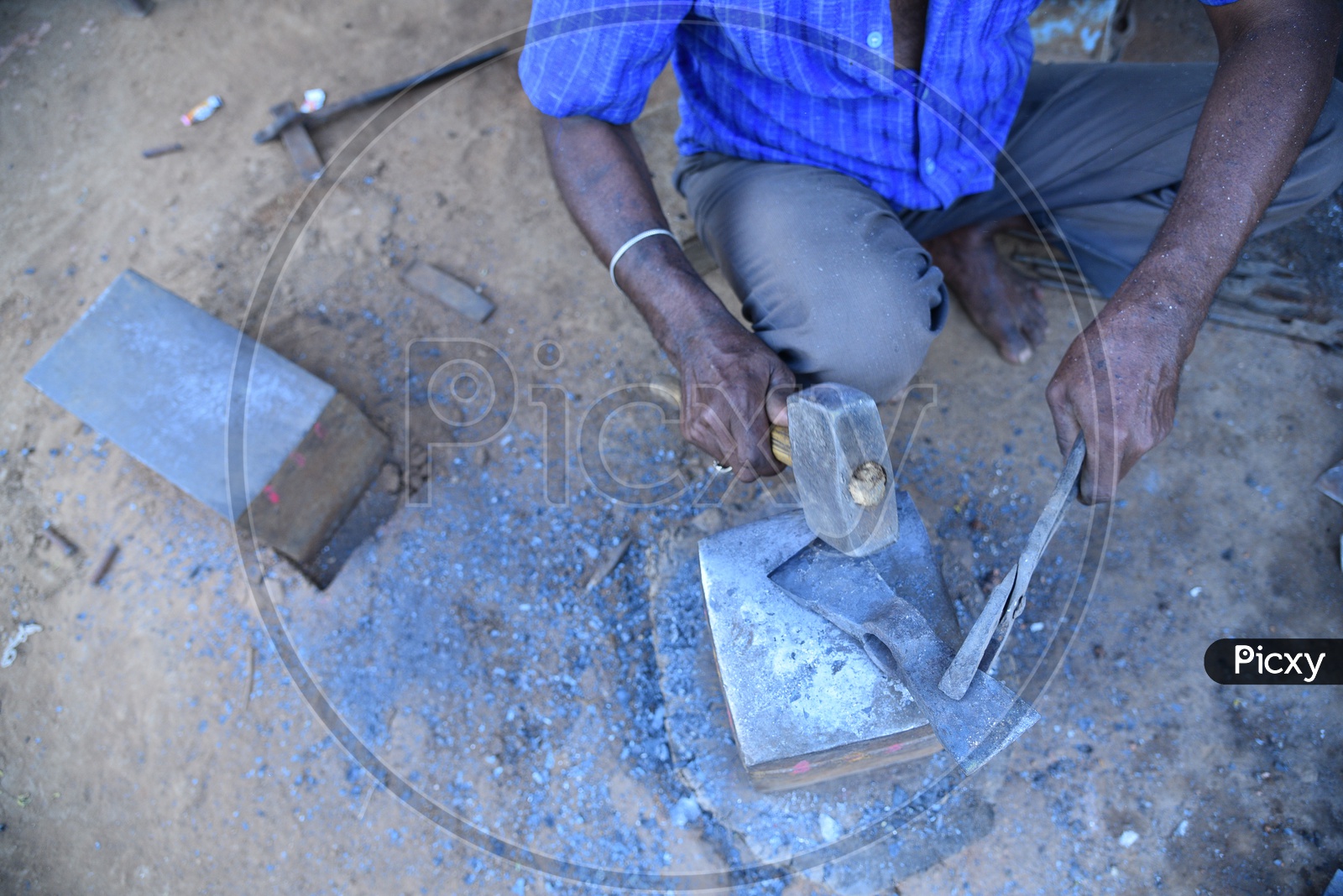 Indian Blacksmith Shaping the Hot Metal using Hammer