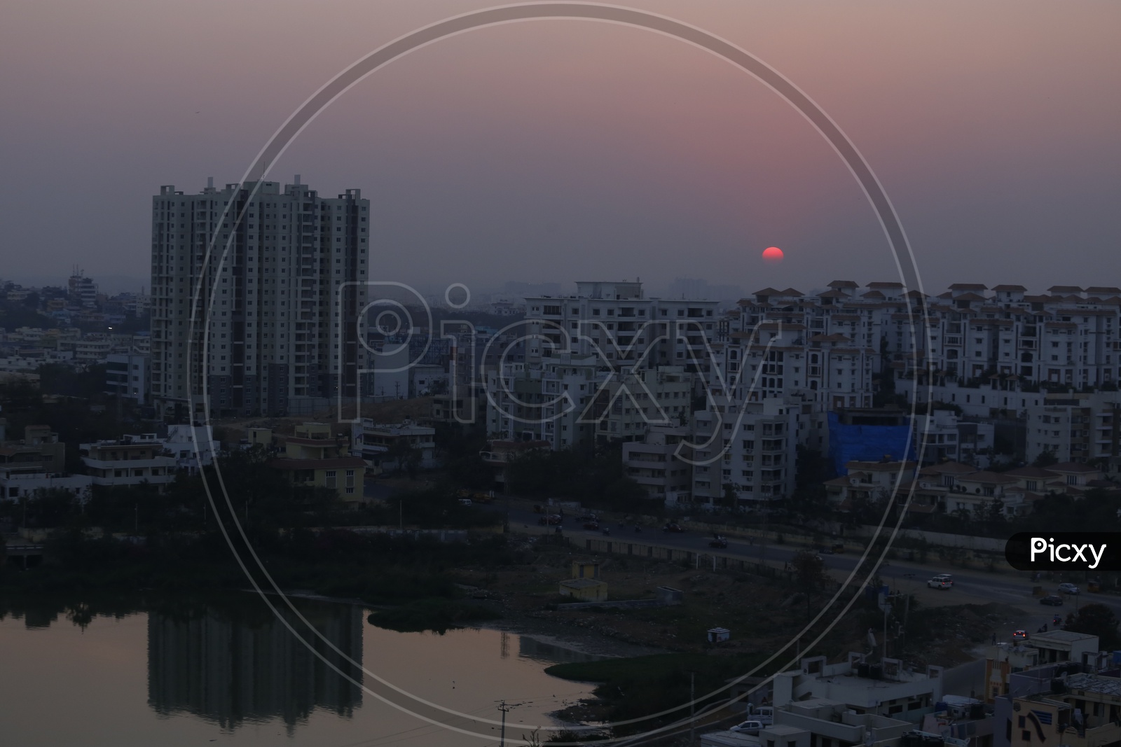 Sunset Over Hyderabad City Scape With Lake And High Rise Buildings Composition