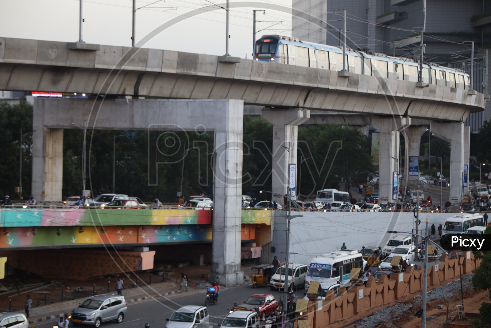Hyderabad Metro train With Commuting Vehicles On Road And Flyover At Hi-Tech City Signal
