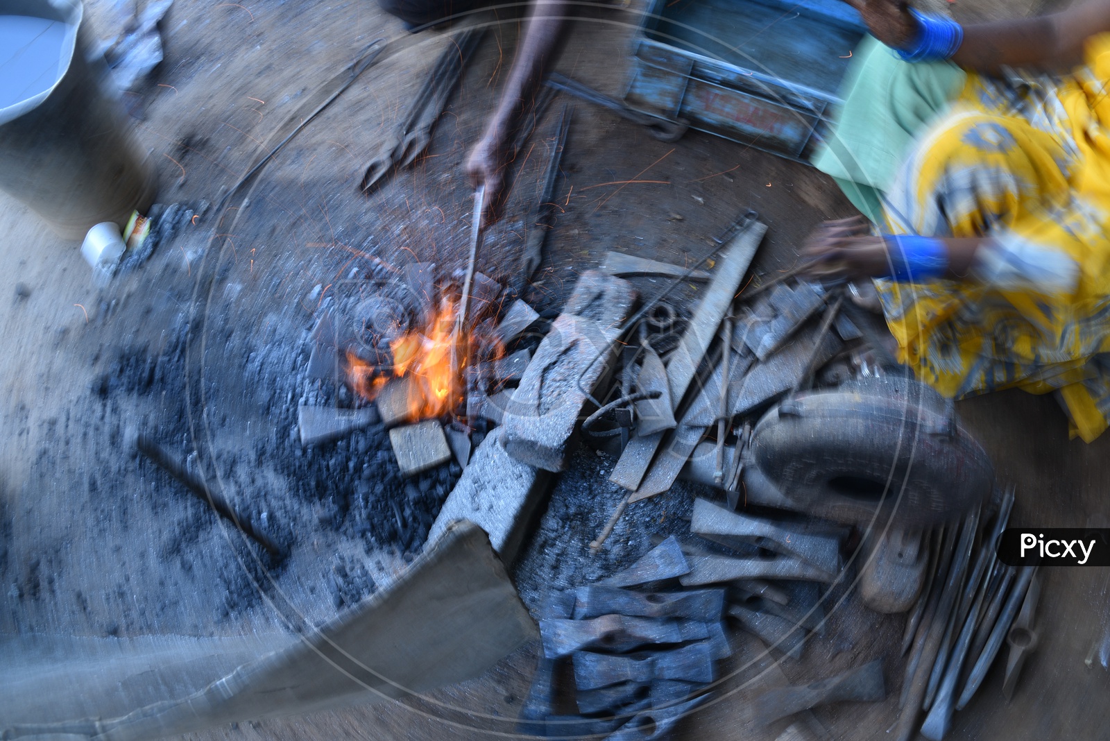 Indian Blacksmith Forges the Hot Iron Metal