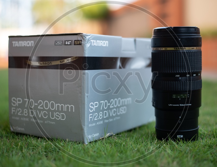 Tamron 70-200mm  DSLR Lens Over Lawn Garden Grass Background
