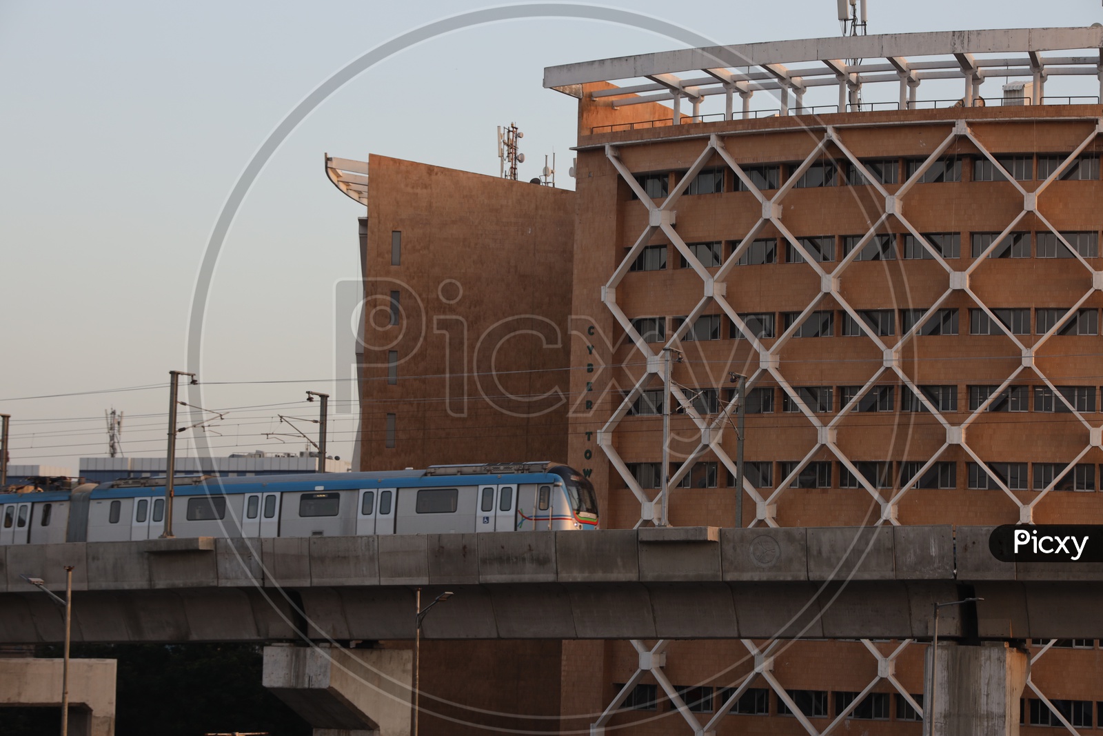 Hyderabad Metro Train  Running on track Composition With Cyber Towers In Background