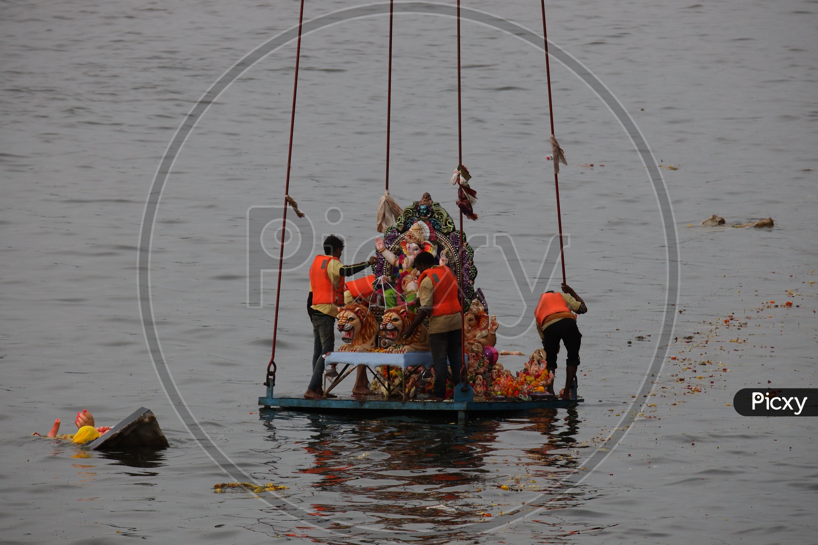 Image Of Lord Ganesh Idols On Cranes For Immersion During Ganesh 
