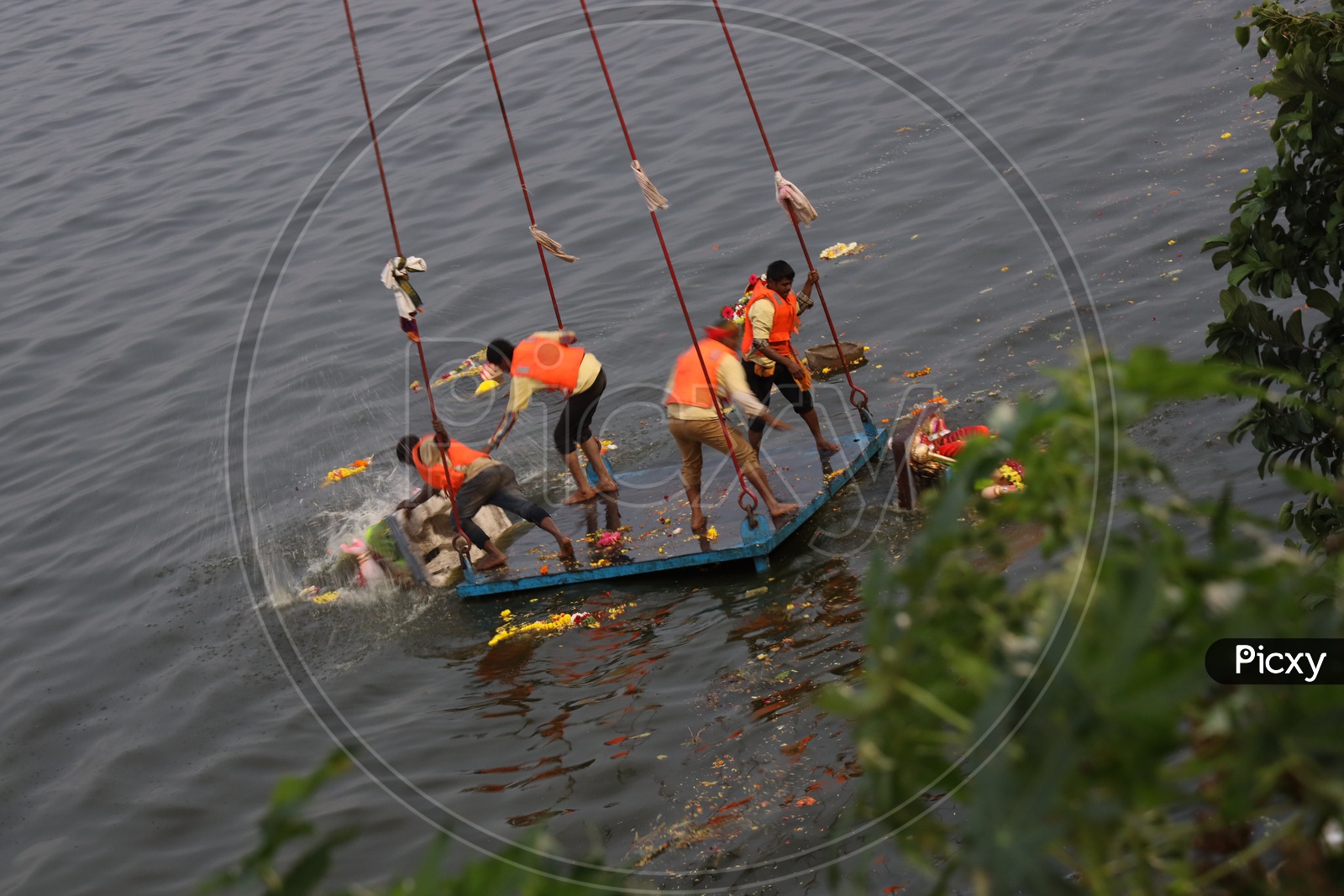 GHMC Arranged Workers Carrying Ganesh Idols In Cranes For Immersion in Hussain Sagar  Lake  During Ganesh Visarjan or Nimarjan Event At Tank Bund